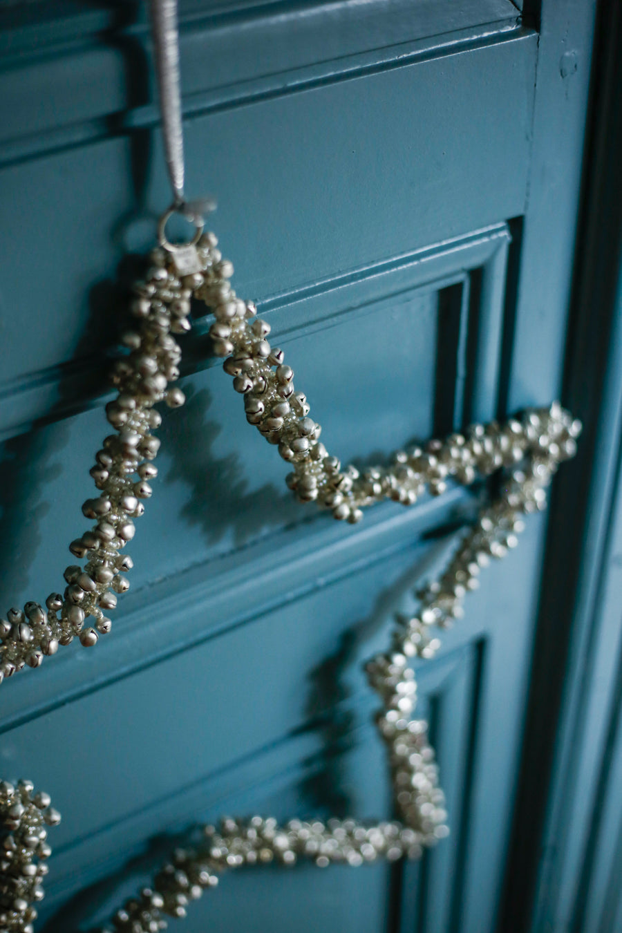 Estrella plateada de minicascabeles M