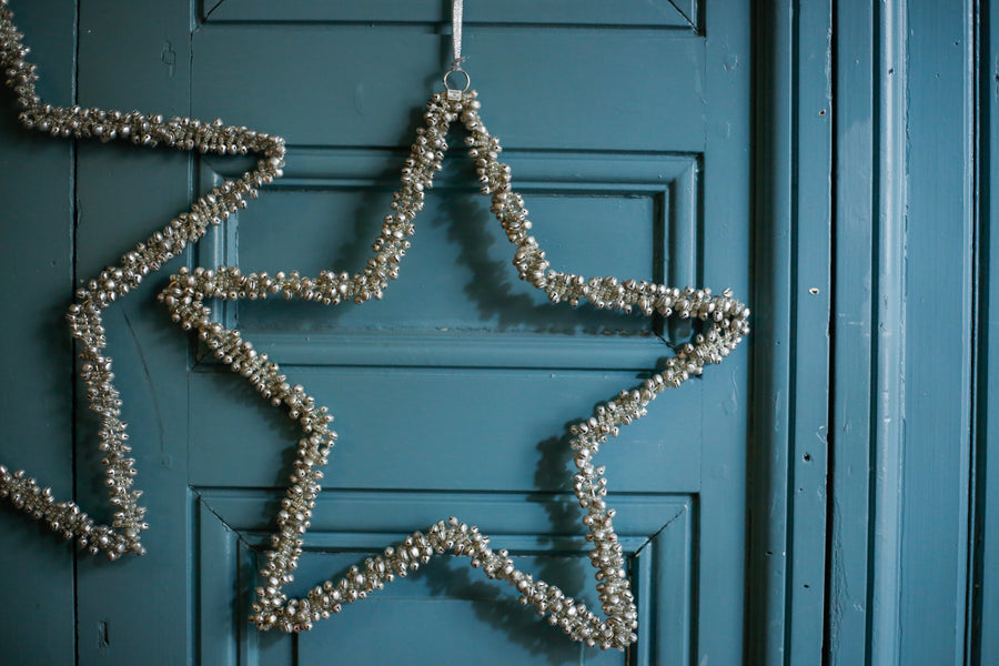 Estrella plateada de minicascabeles M